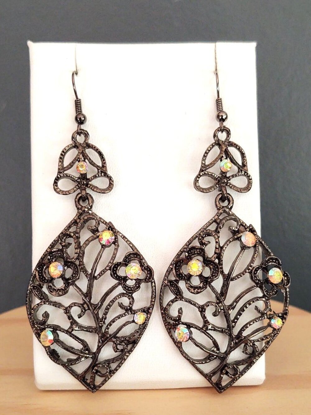 Dark metal dangle earrings with aurora borealis bead accents